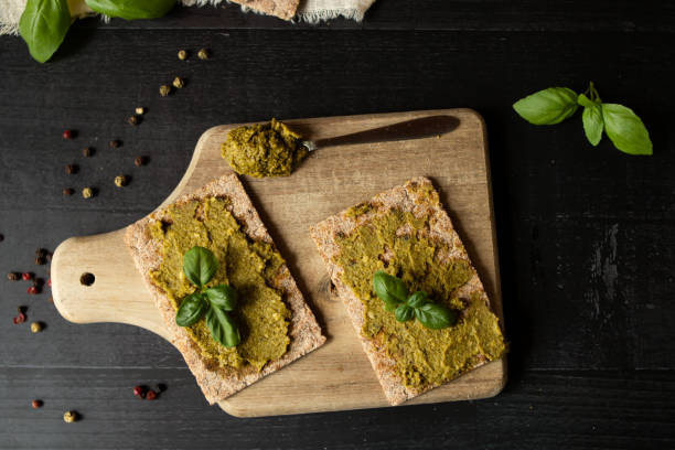 istock Fresh pesto sauce. on a dark background. ingredients 2157928024