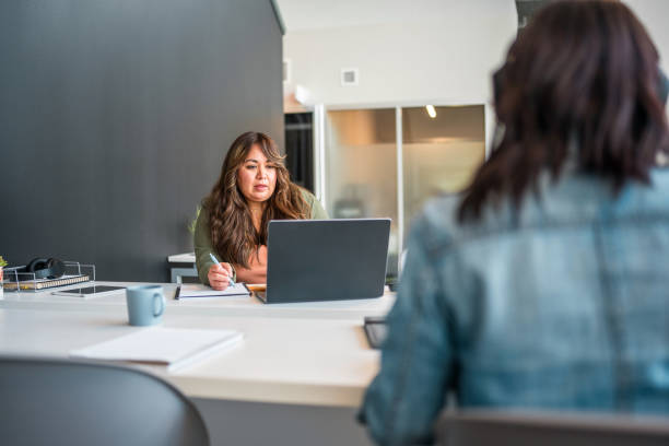 istock Professional Hispanic Woman Engaged in Business Tasks 2157928453