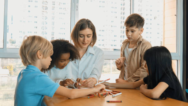 istock Professional caucasian teacher telling story to diverse student. Erudition. 2157928616