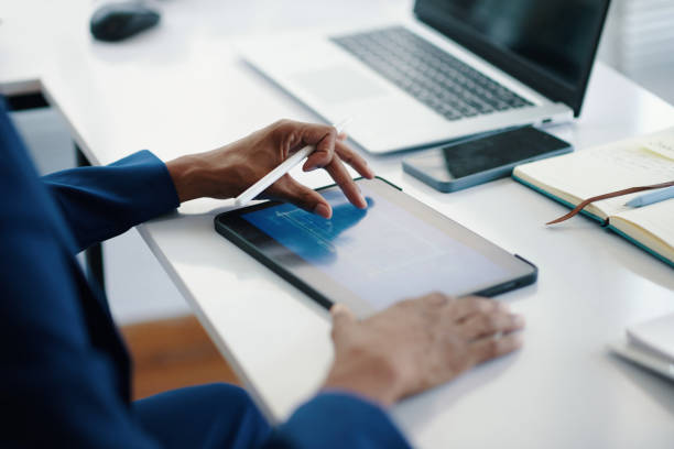 istock Investor Checking Blueprint on Tablet 2157928895