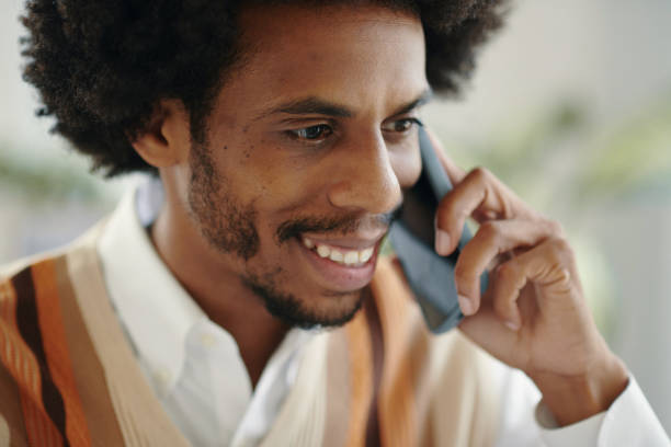 istock Black Man Talking on Phone 2157928905