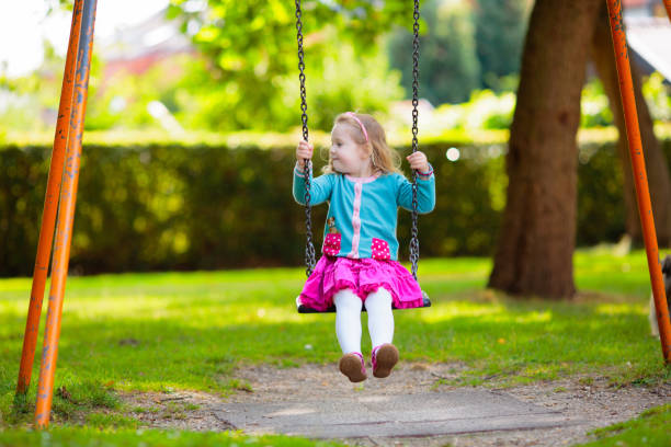 istock Kids explore nature. Children play in sunny park. 2157929173