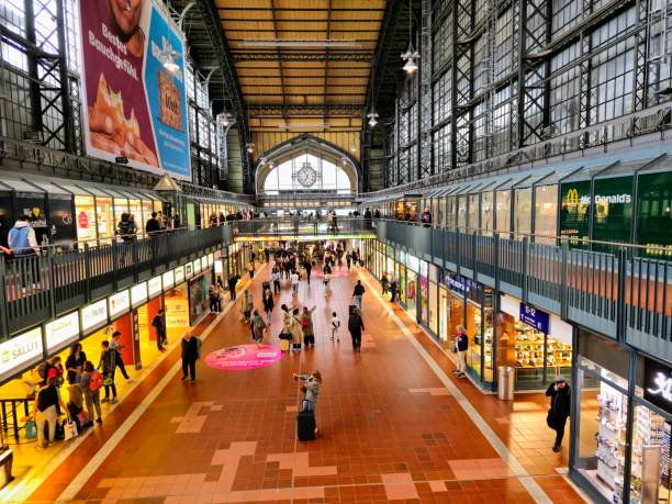 Hamburg Hauptbahnhof, or Hamburg Central Railway Station, is the main railway station of the city of Hamburg, Germany. Opened in 1906. With an average of 550,000 passengers a day, it is Germany's busiest railway station. The image shows the Wandelhalle with several shops and restaurants.
