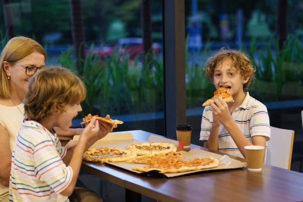 istock Family eating pizza. Italian restaurant. 2157929576