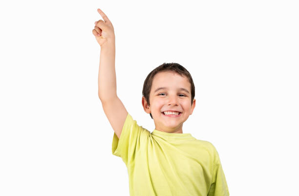 Face of a excited child pointing up with white background. Horizontal composition.