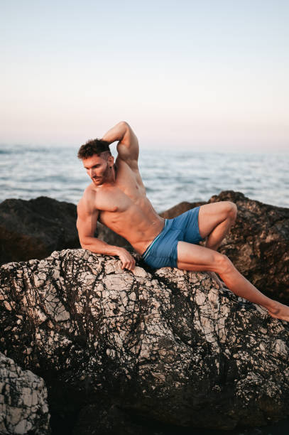 istock Portrait of handsome man on cliff. 2157930700