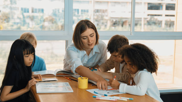 istock Professional caucasian teacher telling story to diverse student. Erudition. 2157930829