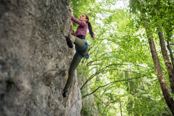 istock Caucasian Female Rock Climber on Rugged Cliff 2157931237