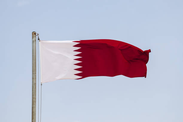 istock Waving flag of Qatar, in Doha 2157931536