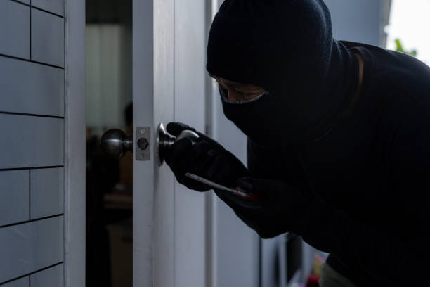 istock The thief is trying to break into the house 2157932988
