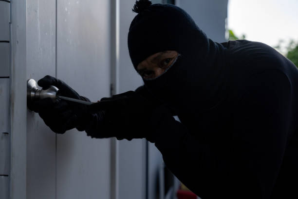 istock The thief is trying to break into the house 2157933000