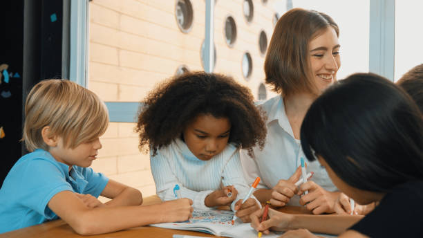 istock Professional caucasian teacher telling story to diverse student. Erudition. 2157933770