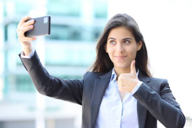 istock Executive taking selfie in the street 2157933863