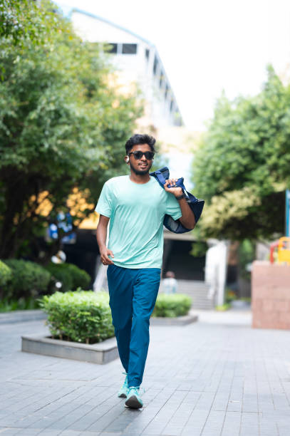 istock Confident Young Man Walking in the City 2157935655