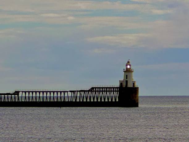 istock Blyth lighthouse flashing on a cloudy morning in Northumberland 2157935902