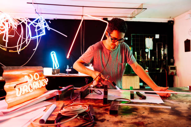 istock Young Adult Working on a Neon Sign in a Workshop 2157936168