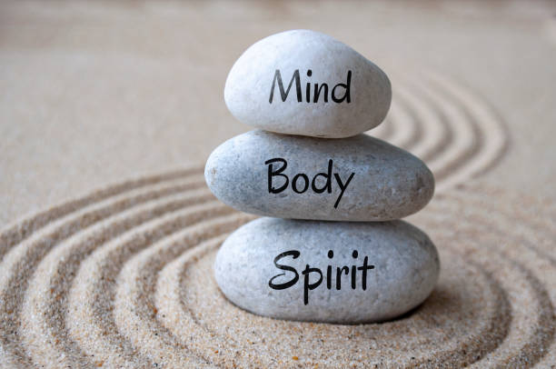 istock Mind, body and soul text on zen stones with sand background 2157936469