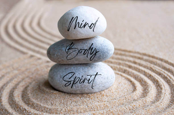istock Mind, body and soul text on zen stones with bright light background 2157936476