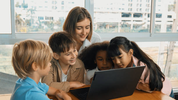 istock Cute girl programing system while surround with teacher and friend. Erudition. 2157937331