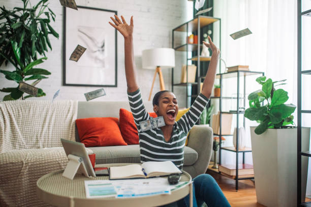 istock Black woman paying the bills online 2157937963