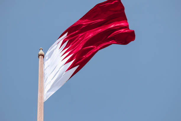 istock Waving flag of Qatar, in Doha 2157938185
