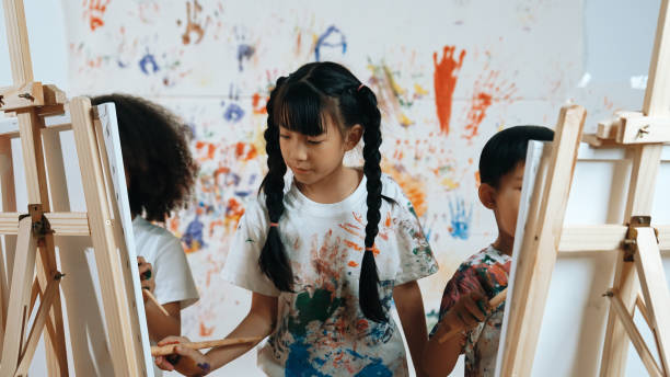 istock Student painted or draw canvas with diverse friends in art lesson. Erudition. 2157938217