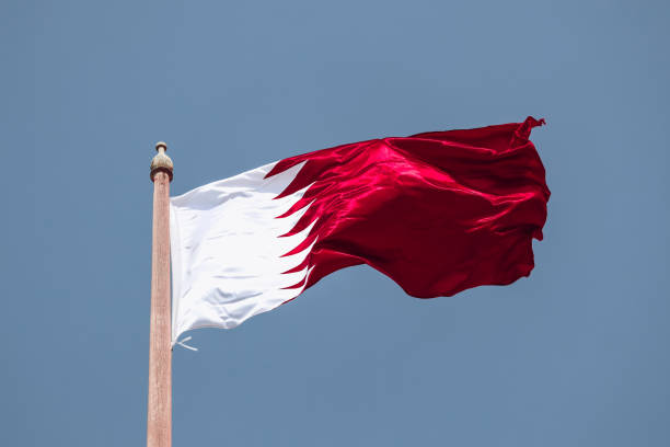 istock Waving flag of Qatar, in Doha 2157938238