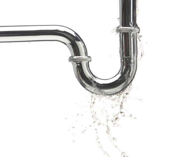 istock Leaking water from chromium stainless steel pipe under sink. Drain leak water from pipe plumbing in bathroom as water always drop. White background isolated 2157939476