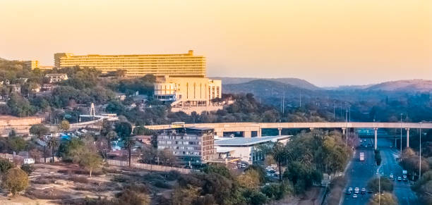 A vibrant view of Kigali's evolving skyline featuring iconic landmarks like the 2000 Hotel and the Bank of Kigali building. This image captures the city's modern architecture under a clear blue sky, showcasing its transformation into a thriving urban hub and a symbol of progress in Rwanda.