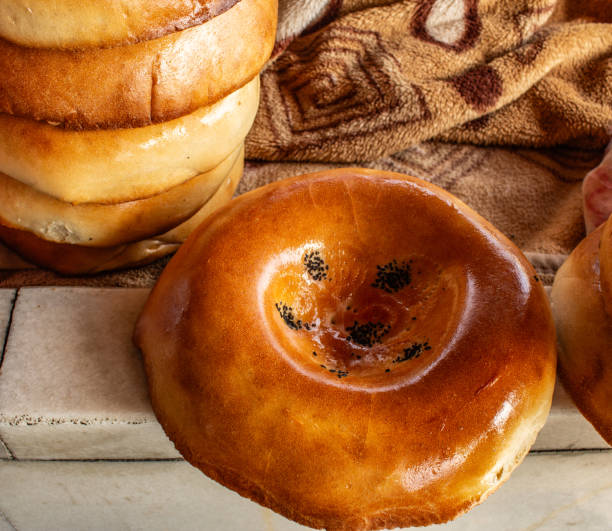 istock Traditional form of Samarkand bread with black sesame seeds, Samarkand bazaar, market 2157940432