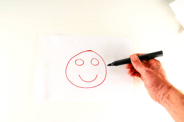istock Close-up of sheet with drawing face 2157941761