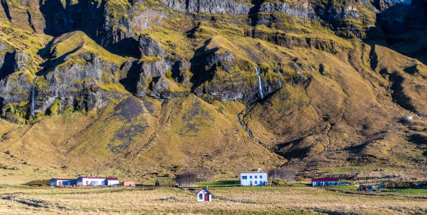 istock A mountain range with a small village in the foreground 2157944345