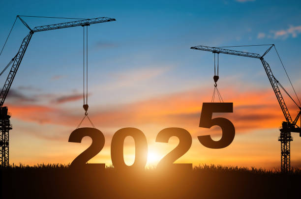 istock Silhouette construction site,Cranes building construction prepare to welcome the new year 2025 at sunset. 2157945028