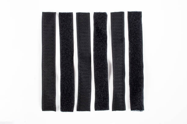 Velcro sticky tape strips pairs isolated on white background, flat lay close up