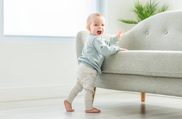 istock Happy toddler boy crawling in sitting room 2157948142