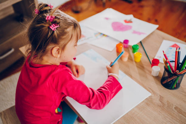 istock Cute little girl drawing at home. 2157948681