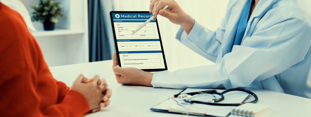 istock Laptop display medical report on blurred doctor office. Rigid 2157948735