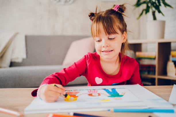 istock Cute little girl drawing at home. 2157948816