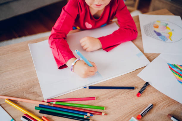 istock Cute little girl drawing at home. 2157948859
