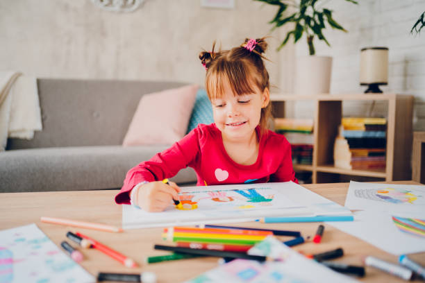istock Cute little girl drawing at home. 2157949149