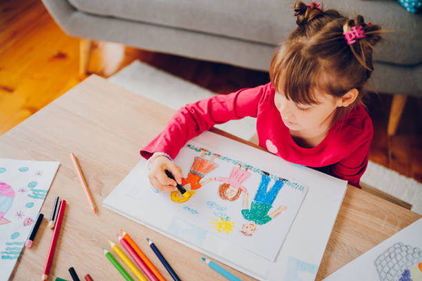 istock Cute little girl drawing at home. 2157949177