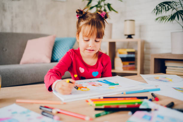 istock Cute little girl drawing at home. 2157949258