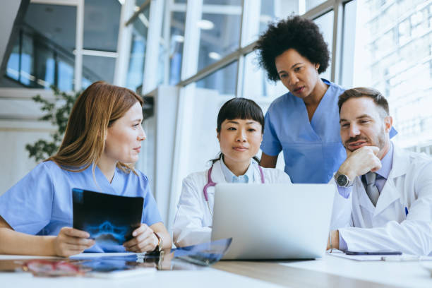 istock Doctors and nurses in a hospital meeting 2157949421