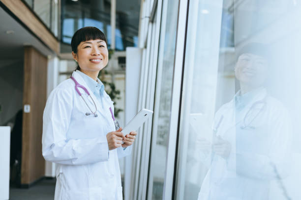 istock Friendly doctor near hospital window 2157949440