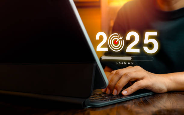 istock 2025 year number with target goal icon and loading bar virtual on screen while businessman working with laptop computer, copy space. New year 2025 coming, business, technology trend and goal concepts. 2157949957