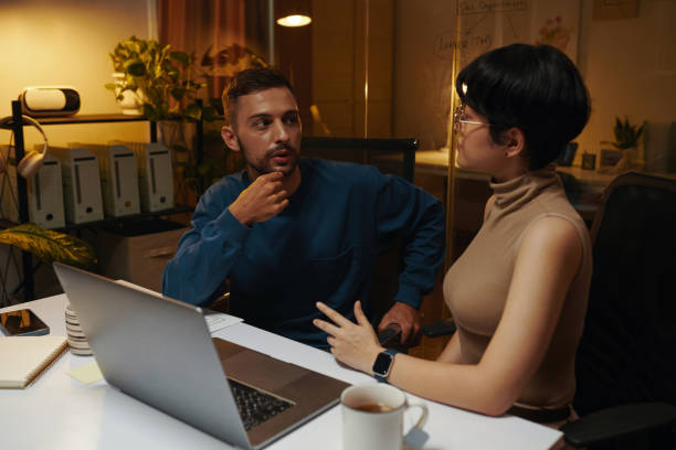 istock Coworkers Staying Late at Night 2157951424