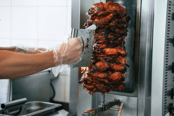 istock Chef preparing and making traditional Turkish Doner Kebab meat. Shawarma or gyros 2157951749