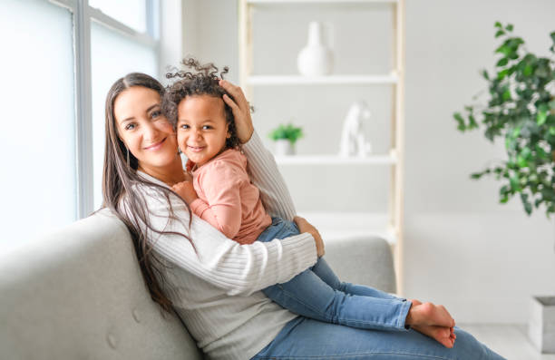 istock Mother with little daughter at home sofa consoling 2157955796
