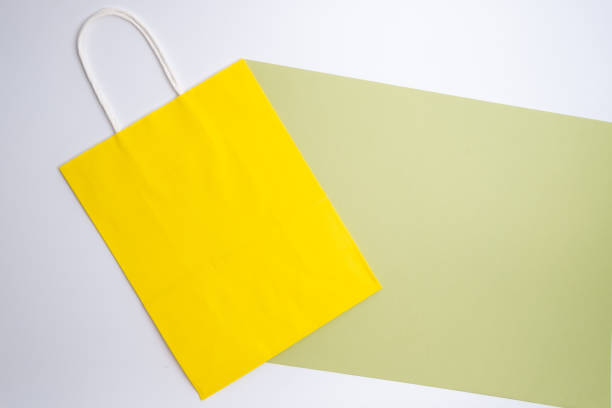 Kraft paper bag on a light background. Delivery and shopping concept. Packaging template mockup