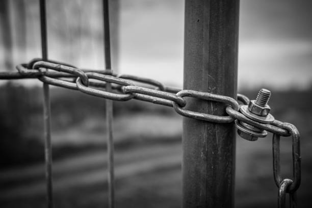 istock the metal lock and the fence 2157959008